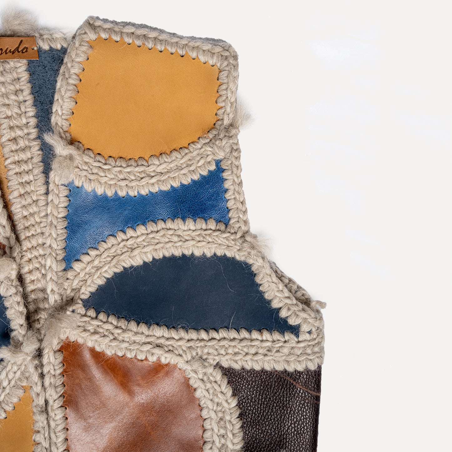 Paçó - patchwork leather vest with wool