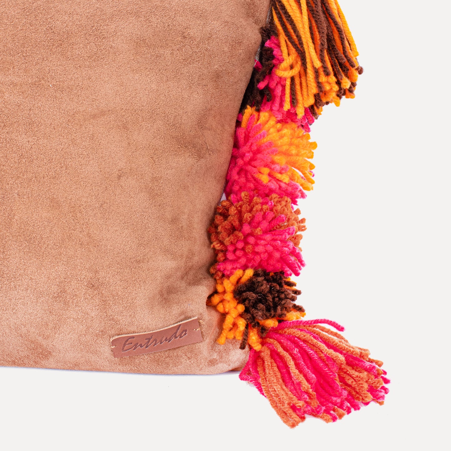 Burga - leather cushion with wool pom poms