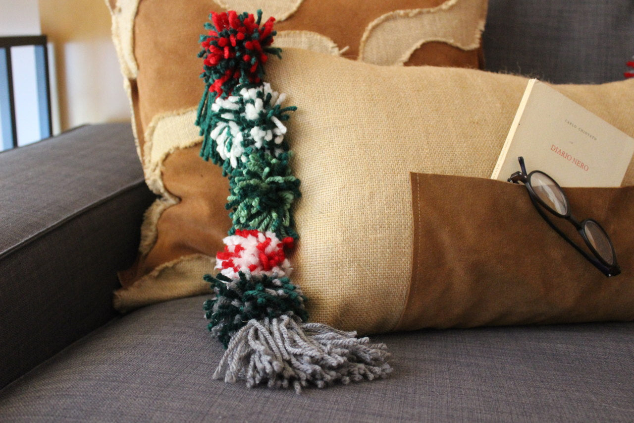 Onor (Special Christmas Edition) - cushion with wool pom poms and a leather pocket