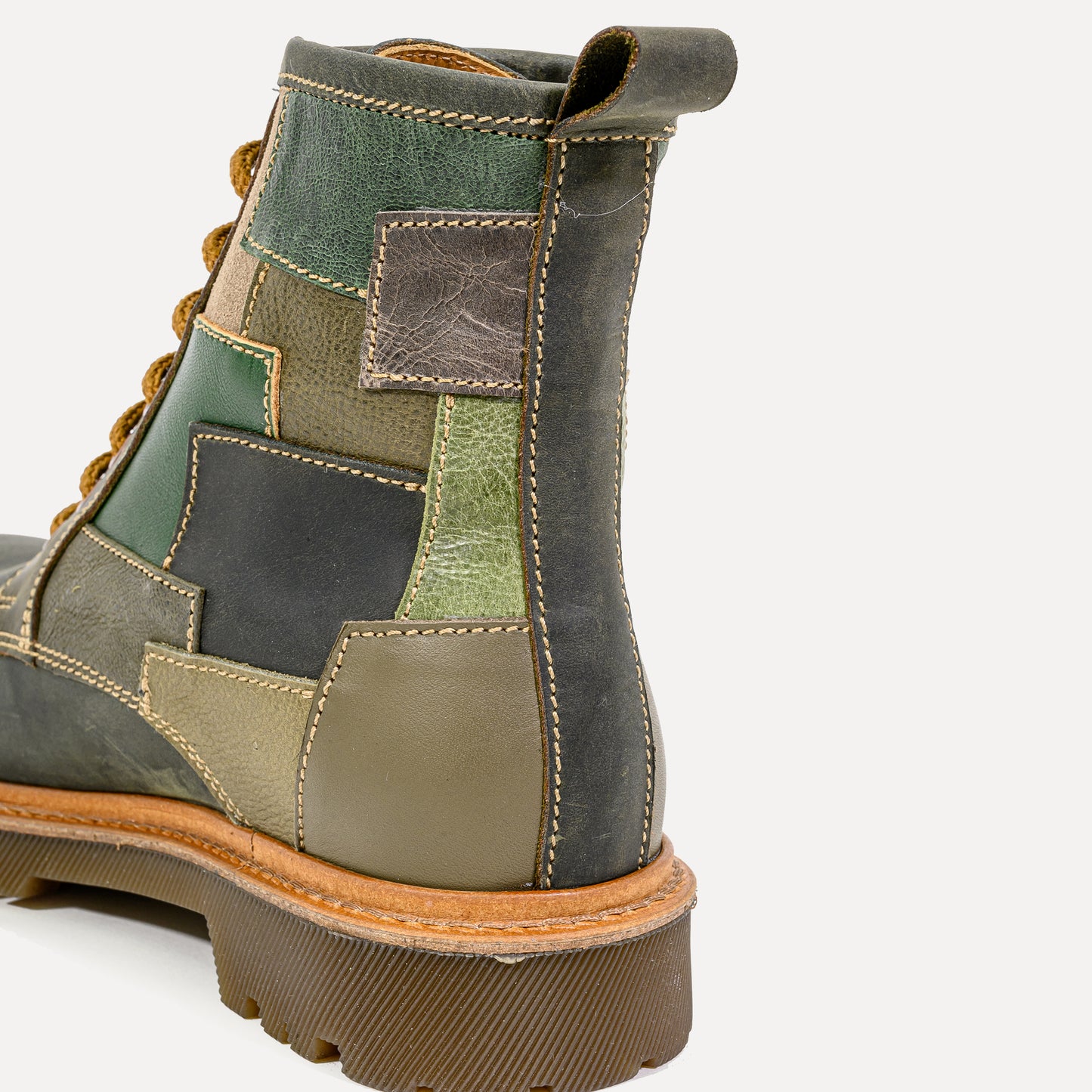 Paçó - leather patchwork boots in green